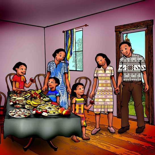 A family standing around a table full of food smiling.